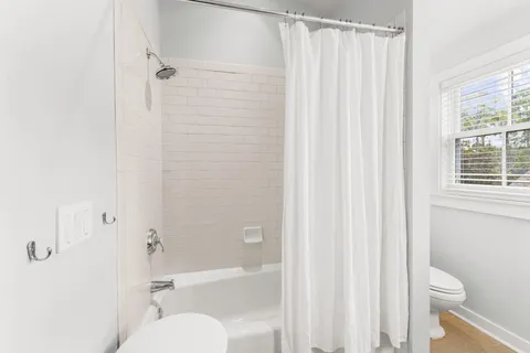 a view of living room with furniture and flat screen tv