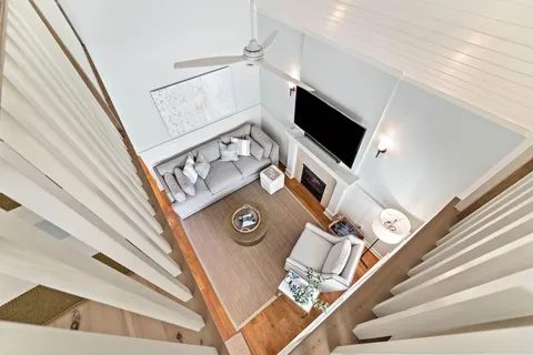 a view of a hallway with the stairs