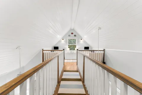 a bedroom with bed and a window