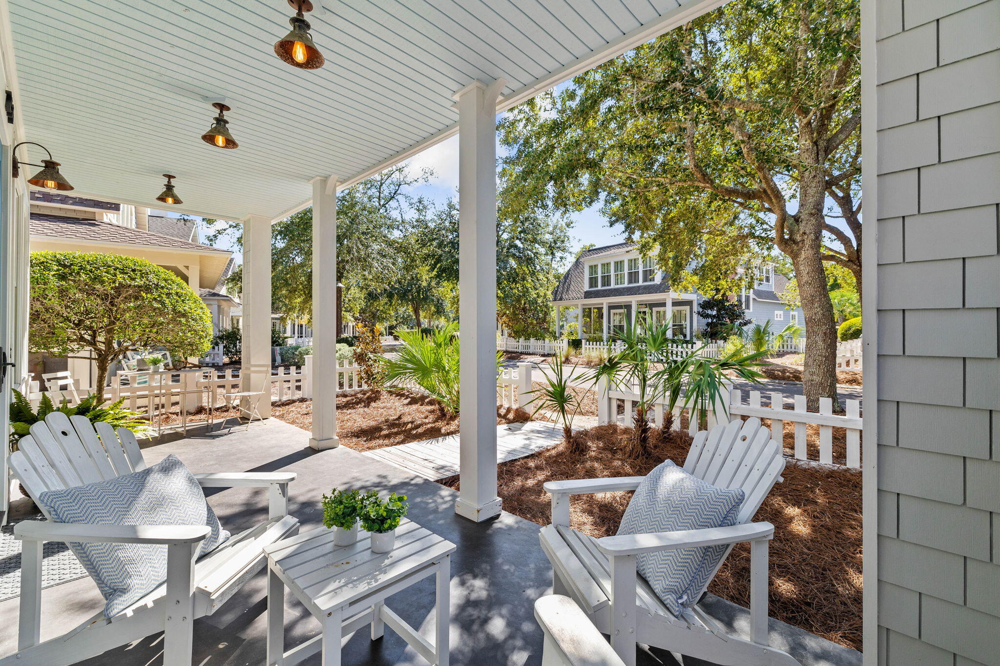 253 Salt Lane Watersound, FL 32461 - Photo 7 of 45 a view of a patio with couches table and chairs and potted plants