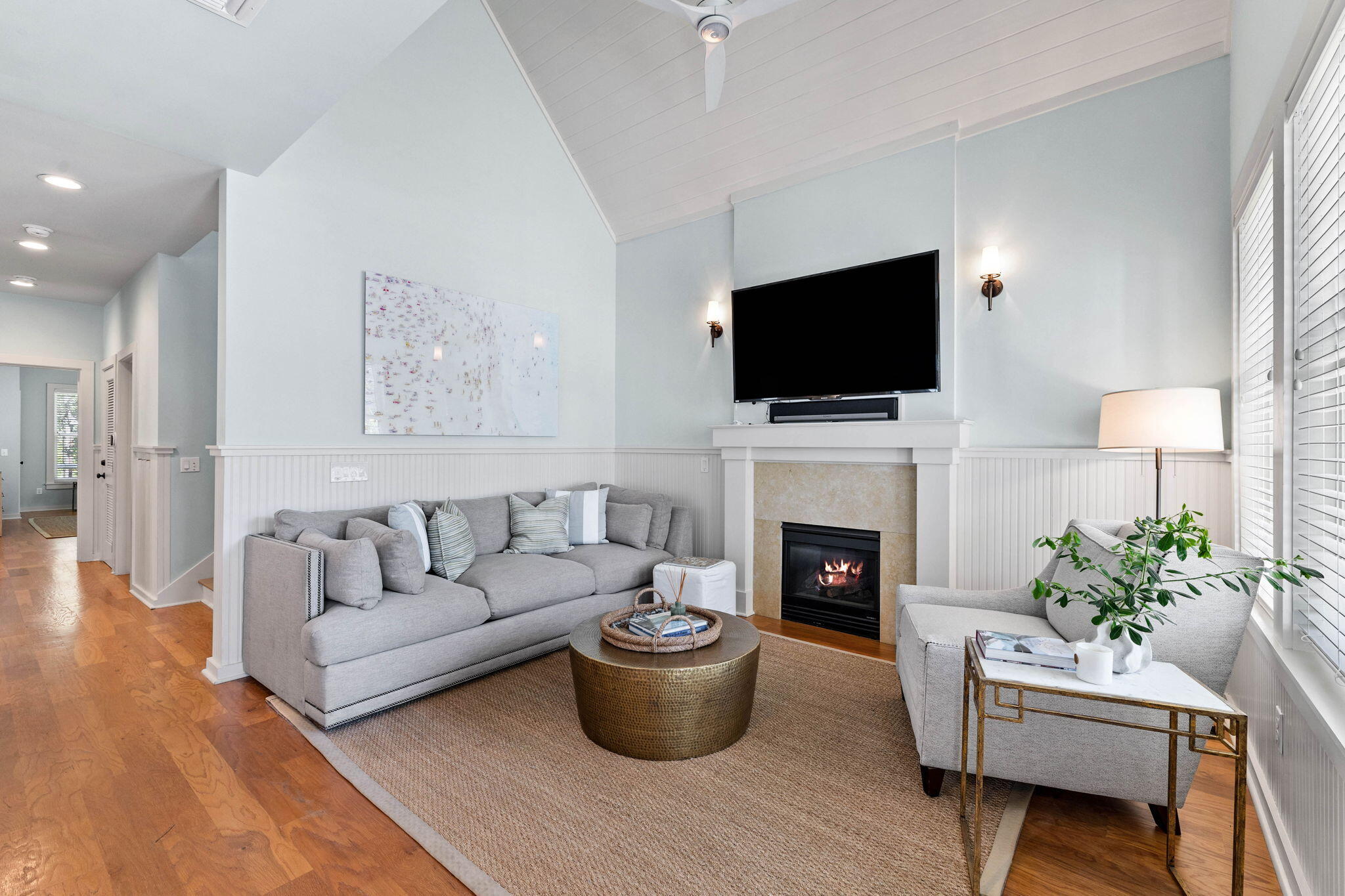 253 Salt Lane Watersound, FL 32461 - Photo 9 of 45 a living room with furniture a flat screen tv and a fireplace