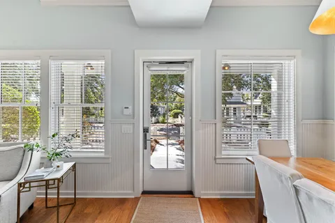 a view of a dining room with furniture window and wooden floor
