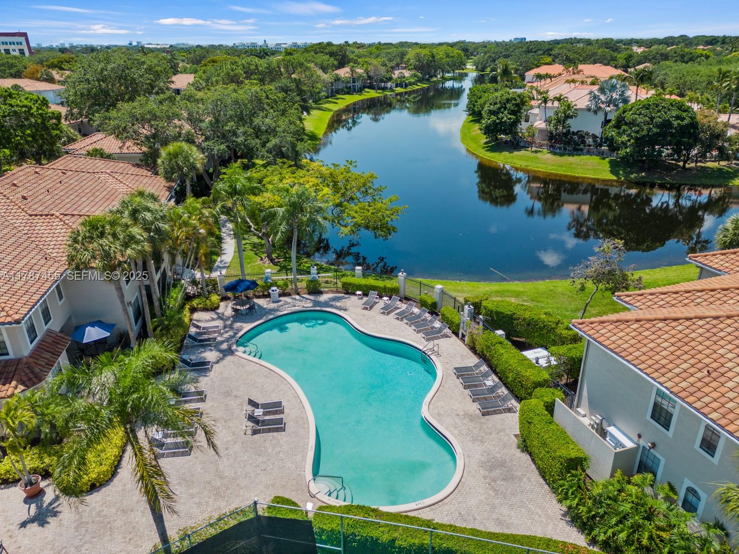 an aerial view of a house with a lake view