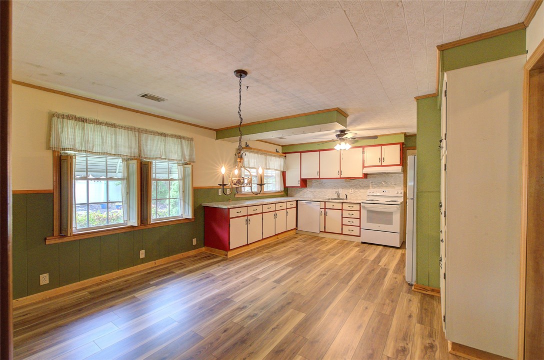 5064 Keowee School Road Seneca, SC 29672 - Photo 14 of 49 This spacious eat-in kitchen features a functional layout and abundant natural light.