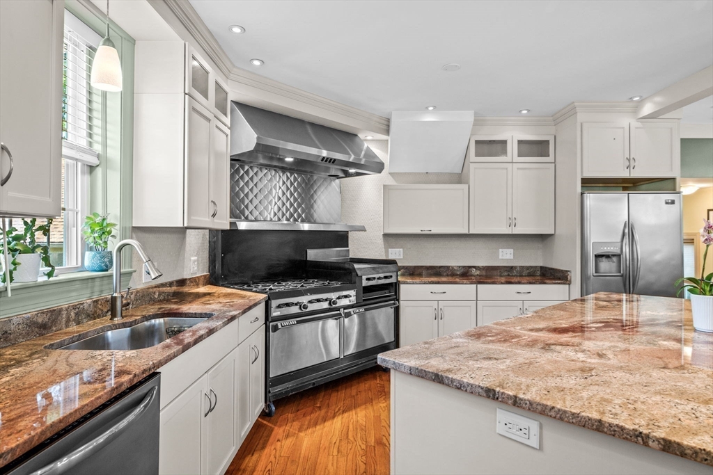 5 Orchard Circle Marblehead, MA 01945 - Photo 11 of 36 a kitchen with stainless steel appliances granite countertop a sink stove and refrigerator