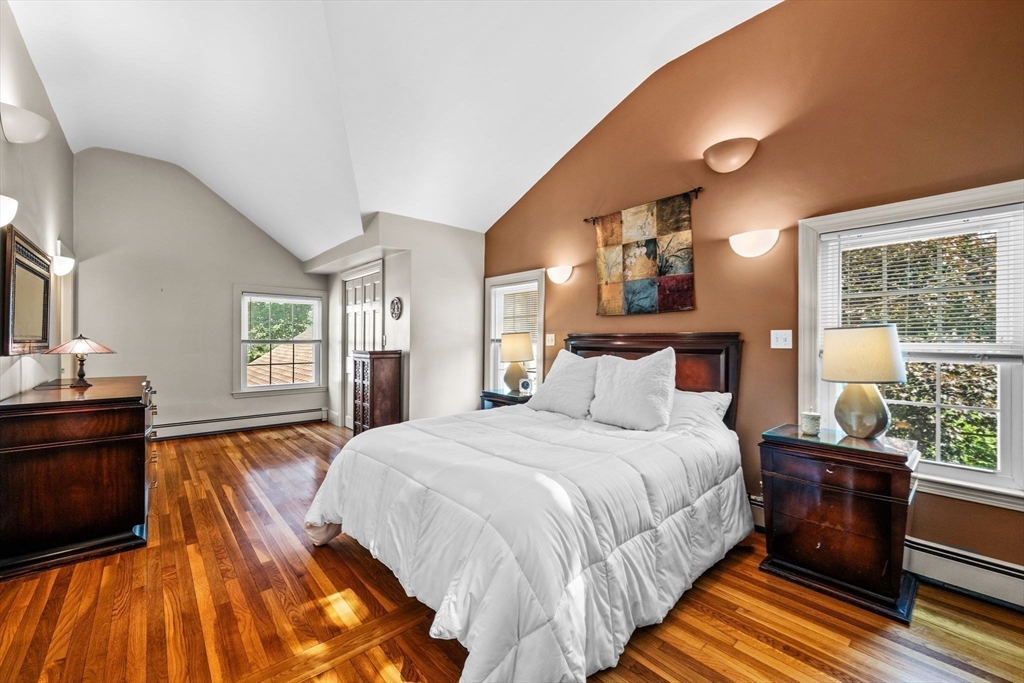 5 Orchard Circle Marblehead, MA 01945 - Photo 16 of 36 a bedroom with a bed and wooden floor