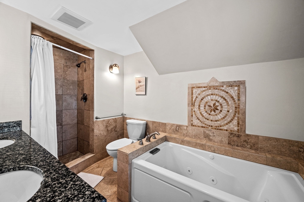 5 Orchard Circle Marblehead, MA 01945 - Photo 18 of 36 a bathroom with a bathtub and shower