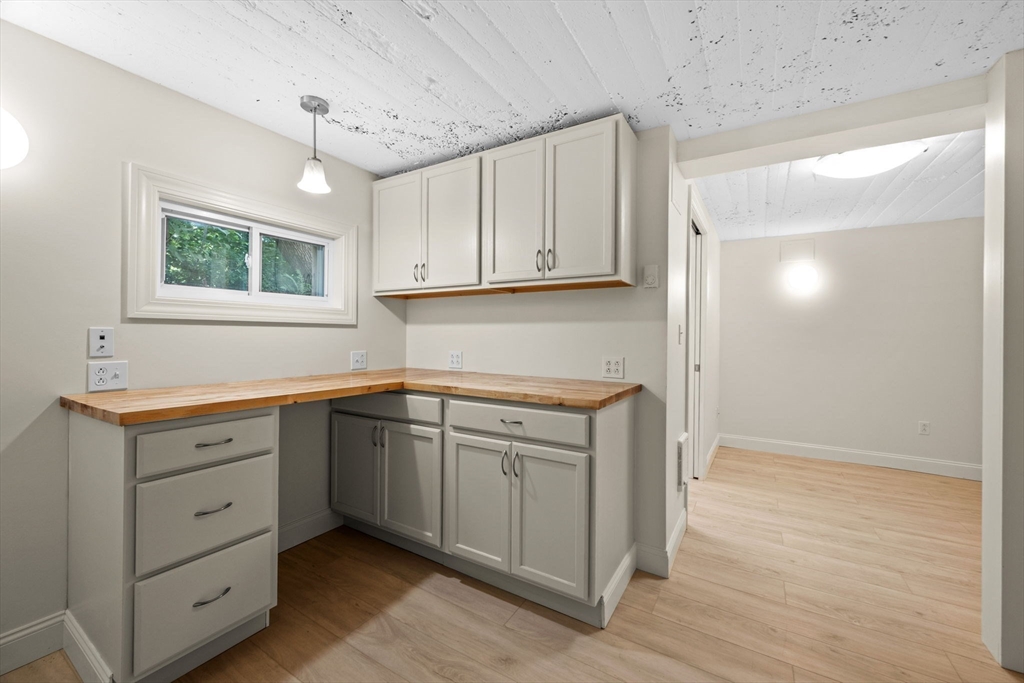 5 Orchard Circle Marblehead, MA 01945 - Photo 24 of 36 a kitchen with white cabinets and window