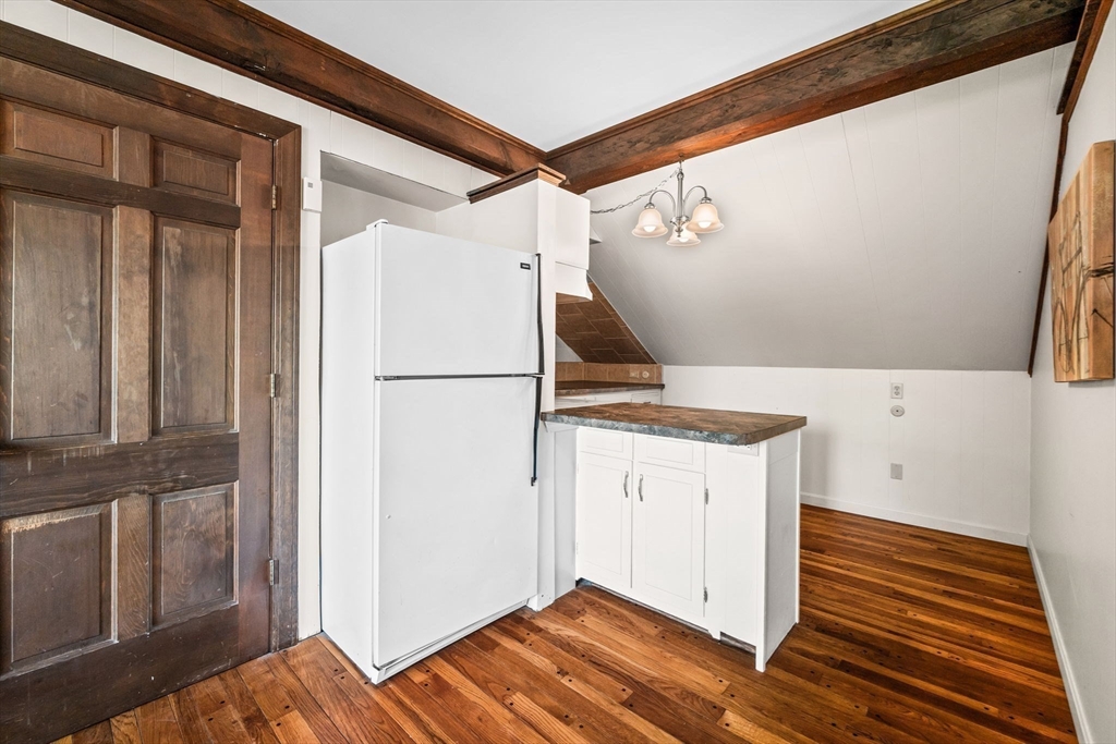 5 Orchard Circle Marblehead, MA 01945 - Photo 29 of 36 a view of a hallway with wooden floor and entryway