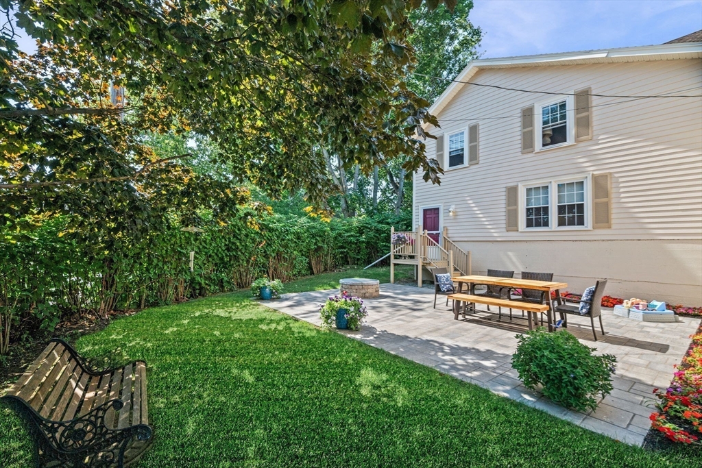 5 Orchard Circle Marblehead, MA 01945 - Photo 3 of 36 a backyard of a house with outdoor seating