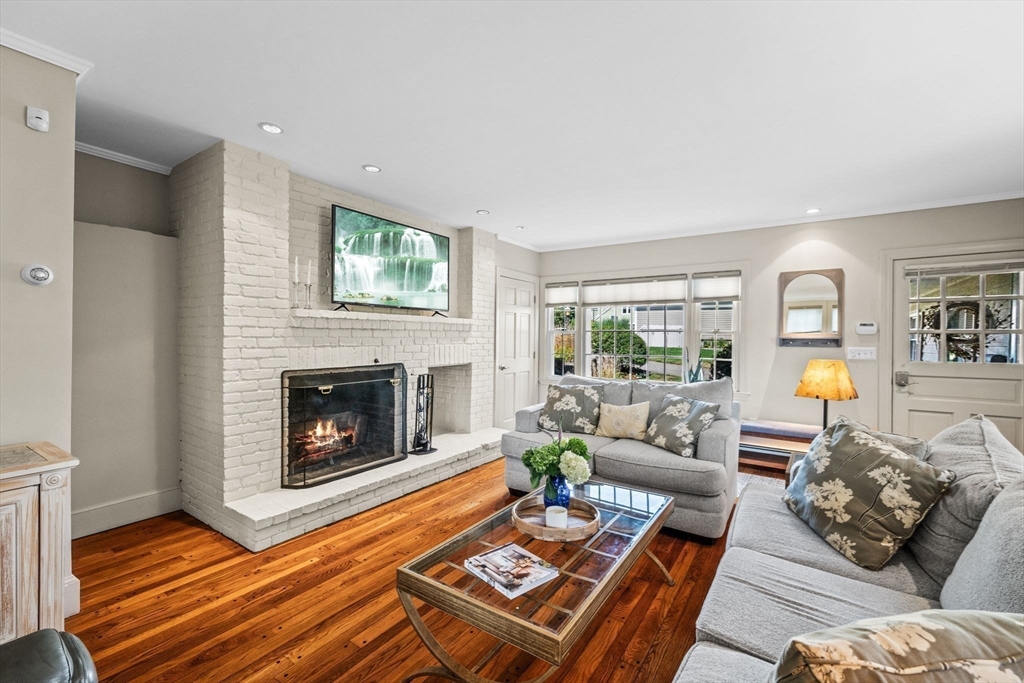5 Orchard Circle Marblehead, MA 01945 - Photo 6 of 36 a living room with furniture and a fireplace