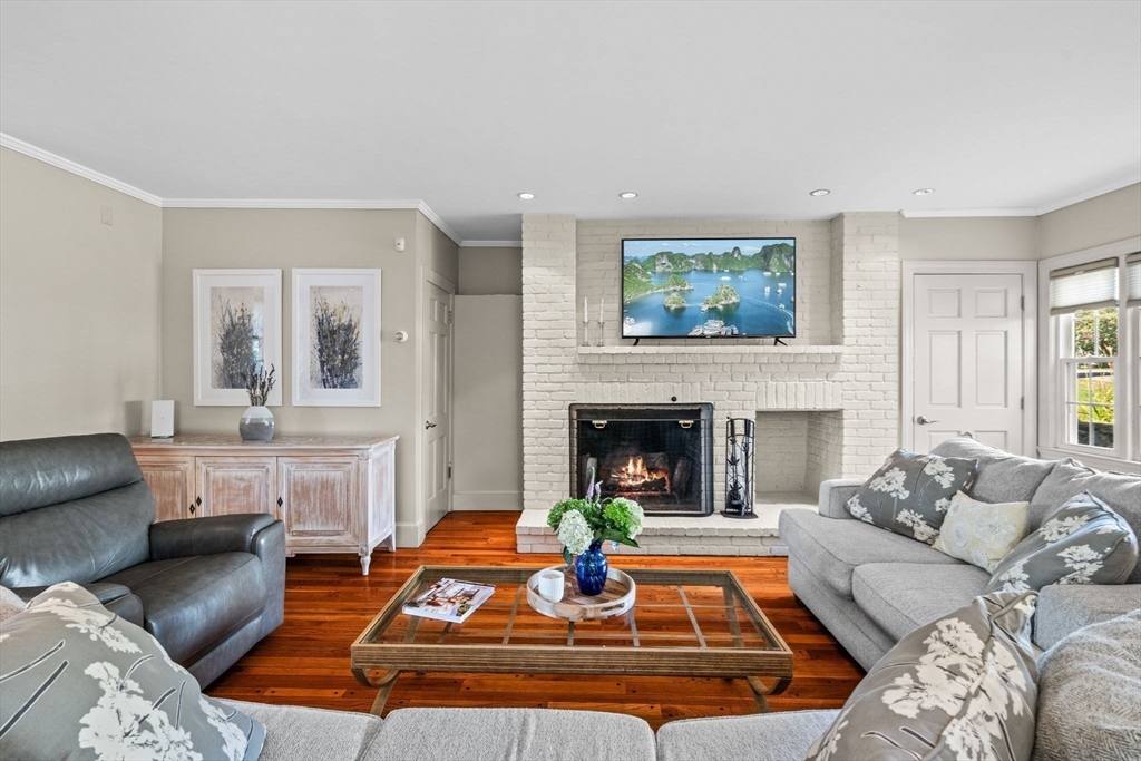 5 Orchard Circle Marblehead, MA 01945 - Photo 7 of 36 a living room with furniture and a fireplace