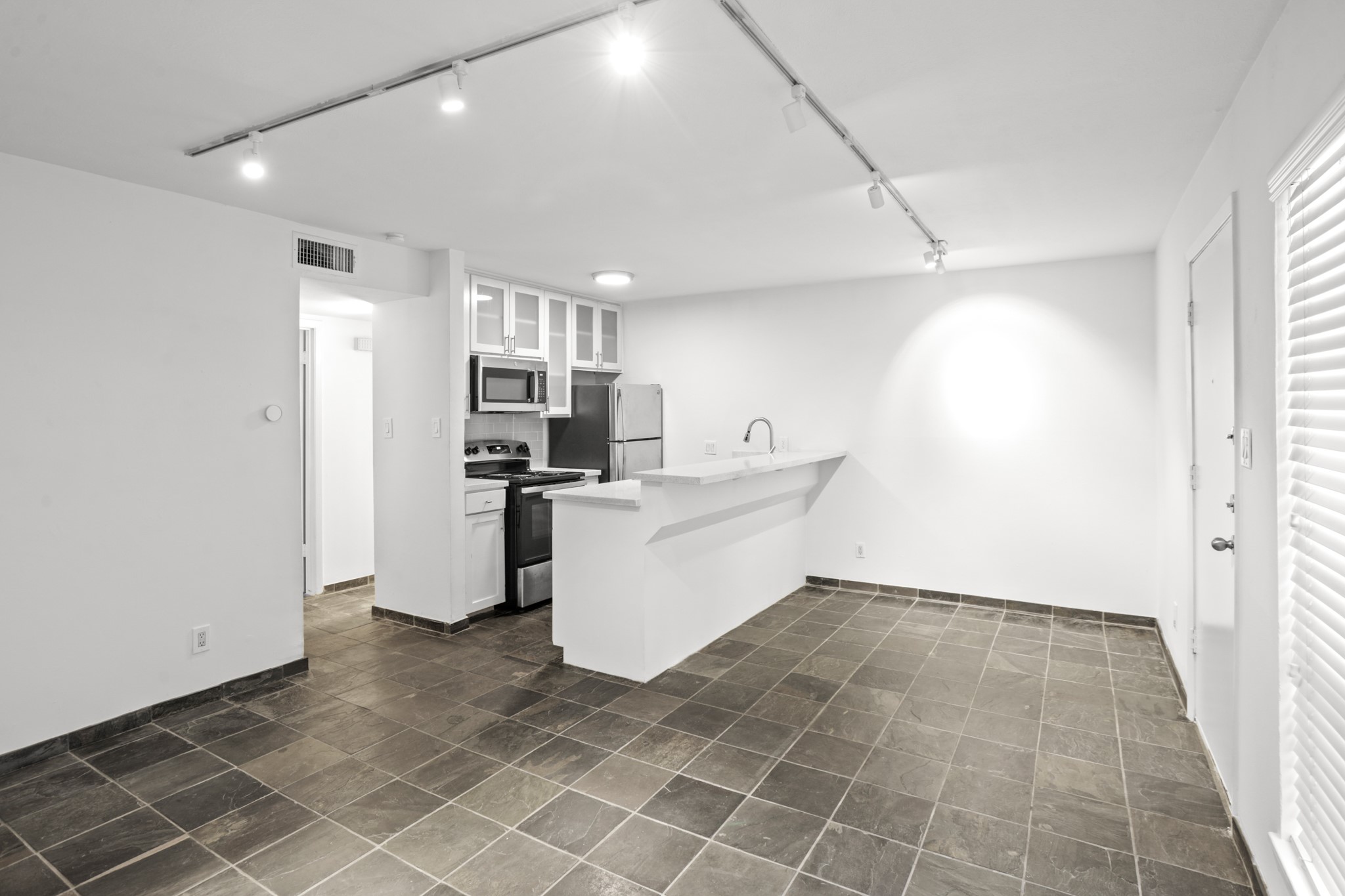 3602 Garrott Street, Unit 3 Houston, TX 77006 - Photo 16 of 34 This is the view from the living area to the kitchen and dining area.