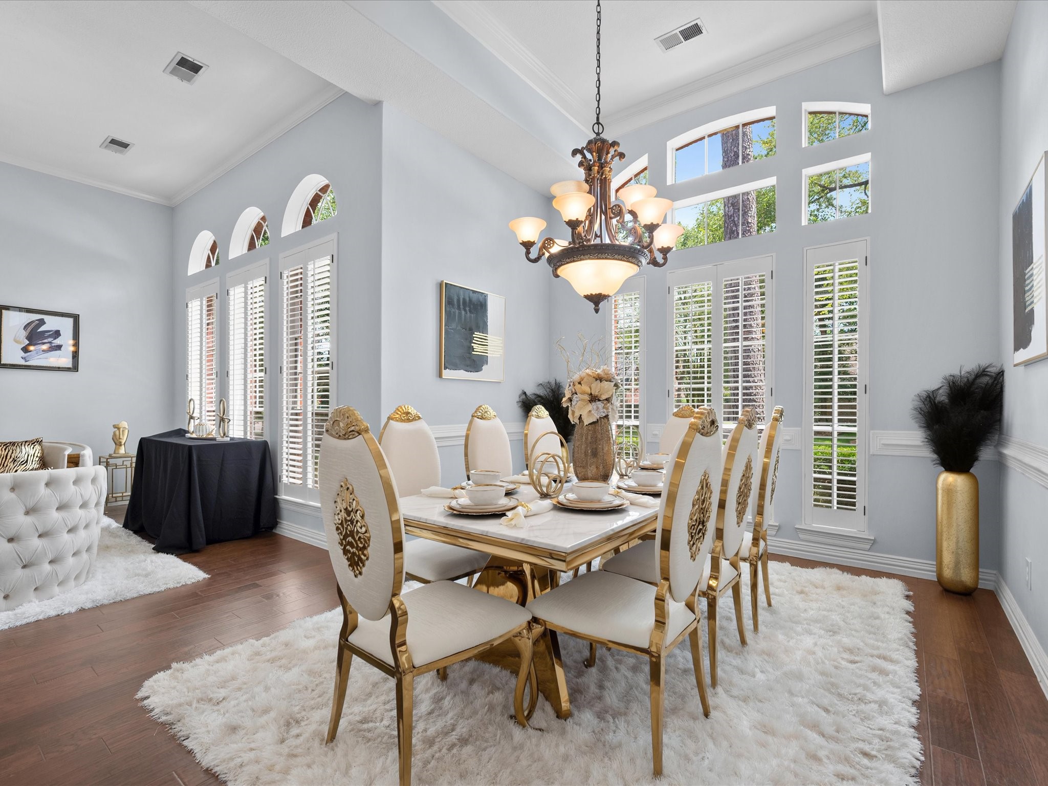 16123 Lafone Drive Spring, TX 77379 - Photo 9 of 47 Bathed in natural light from expansive windows, the formal dining room offers an elegant setting for holiday gatherings, celebrations, and everyday meals.