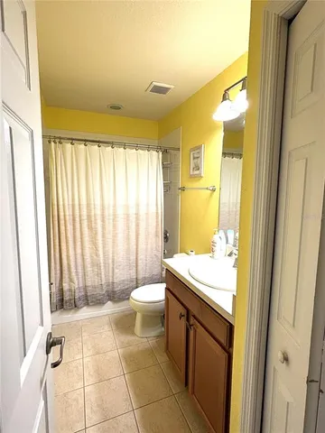 a bathroom with a sink a toilet and a shower