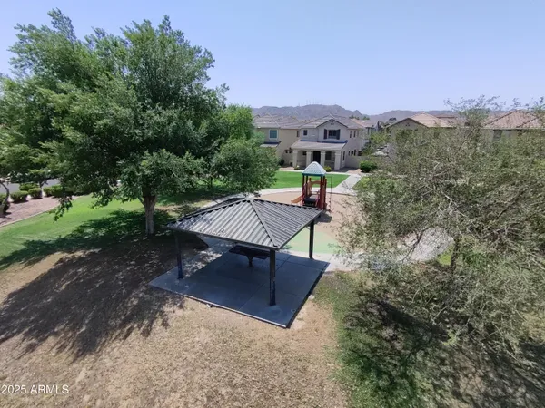 an aerial view of a house with a yard