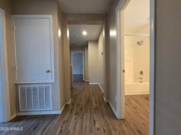 a view of a bathroom from a hallway