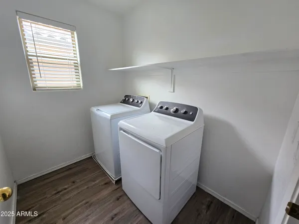 a kitchen with kitchen island granite countertop a stove and a sink