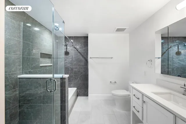 a bedroom with a large bed and a large window