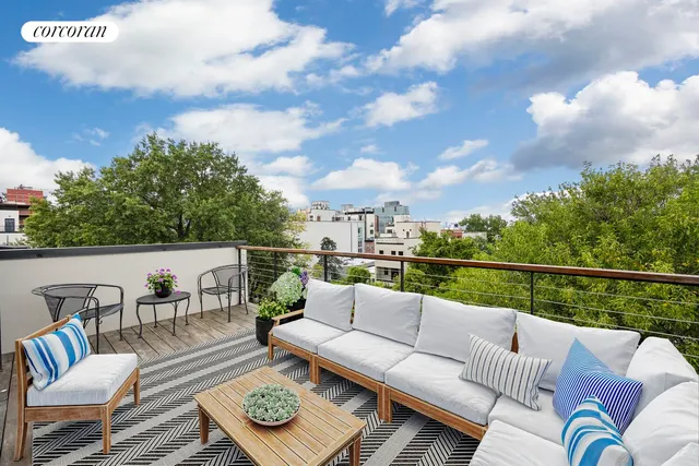 a view of a terrace with furniture