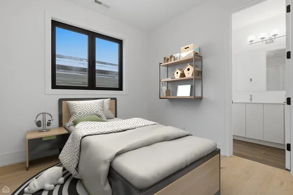 a bedroom with a large bed and a painting on the wall