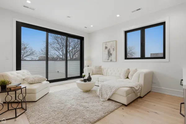 a bedroom with a bed and a couch