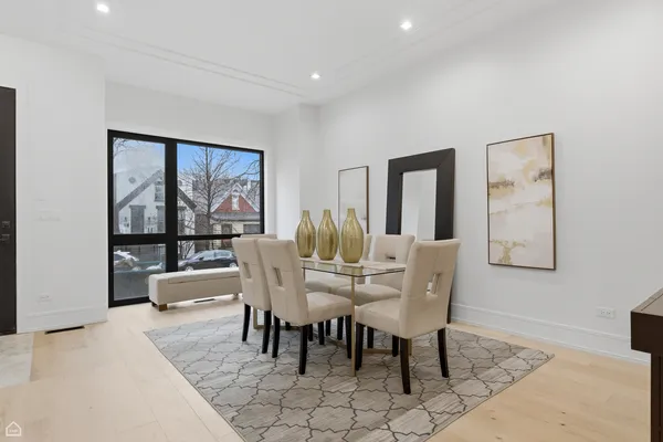 a view of a kitchen area with furniture and chandelier