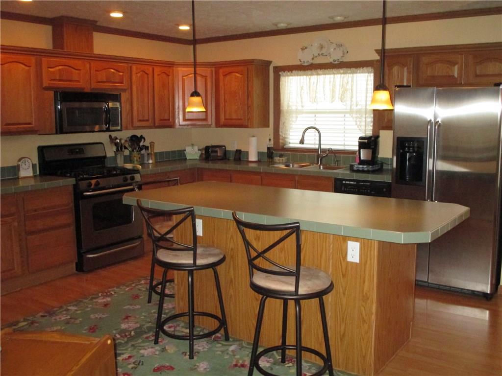 435 Ridgemont Drive Industry, PA 15052 - Photo 5 of 25 Kitchen with stainless steel appliances and island.