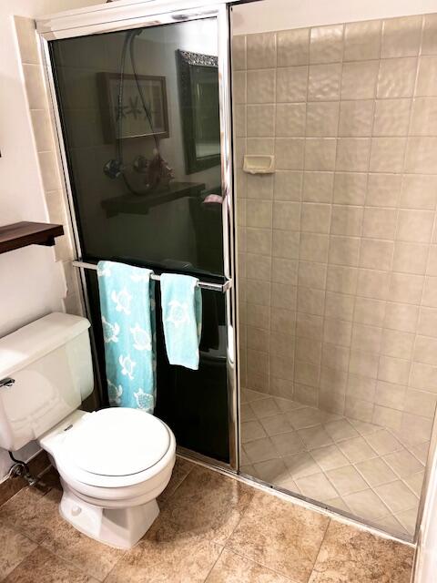 10323 Boca Bend West, Unit K4 Boca Raton, FL 33428 - Photo 11 of 25 a bathroom with a toilet and a shower