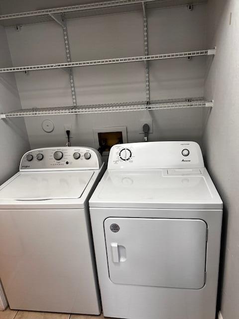 10323 Boca Bend West, Unit K4 Boca Raton, FL 33428 - Photo 20 of 25 a utility room with dryer and washer