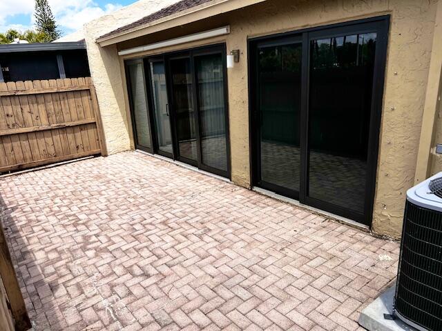 10323 Boca Bend West, Unit K4 Boca Raton, FL 33428 - Photo 22 of 25 a bedroom with a bed and a cabinets