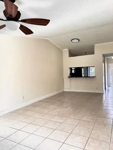 a view of a living room with a wooden floor