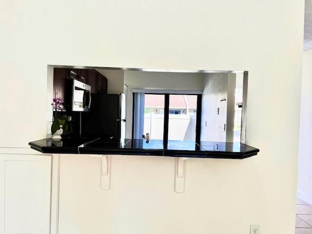 10323 Boca Bend West, Unit K4 Boca Raton, FL 33428 - Photo 4 of 25 a view of a living room with a wooden floor