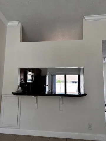 a kitchen with stainless steel appliances granite countertop a stove microwave and sink