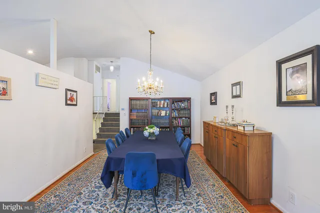 a kitchen with kitchen island granite countertop a sink and a stove