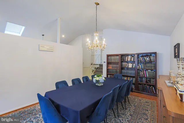 a kitchen with stainless steel appliances a refrigerator a stove a sink and a refrigerator