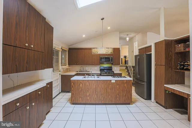 a kitchen with a stove and a sink