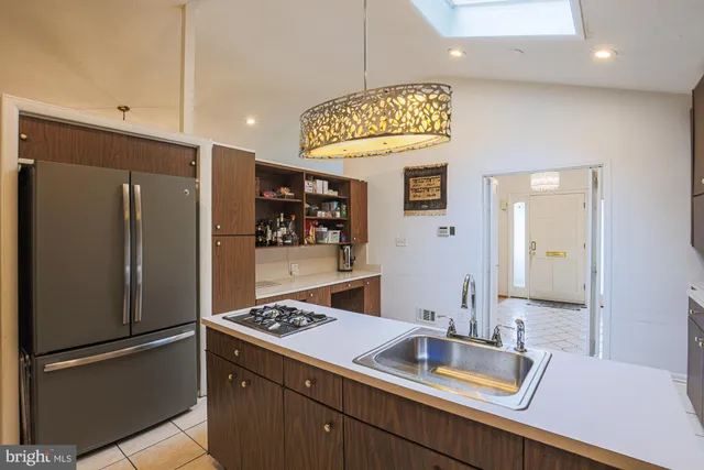 a bedroom with a bed and a night stand