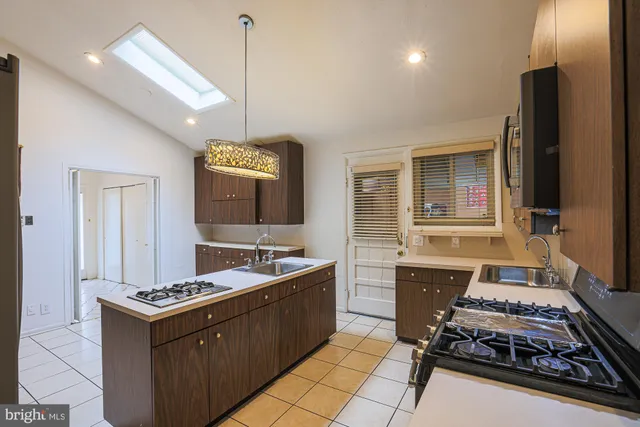 a bedroom with a bed and a lamp