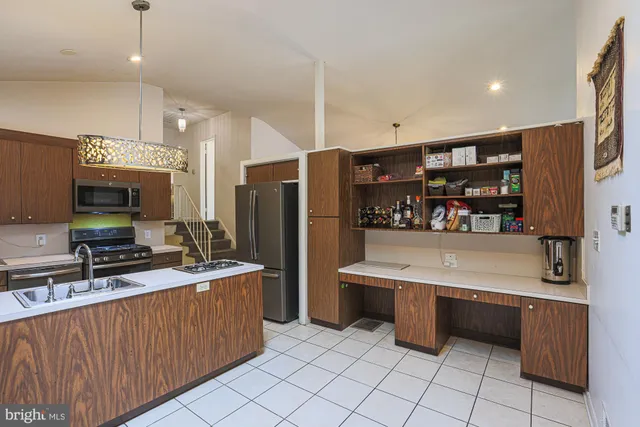 a white toilet sitting next to a bathroom sink