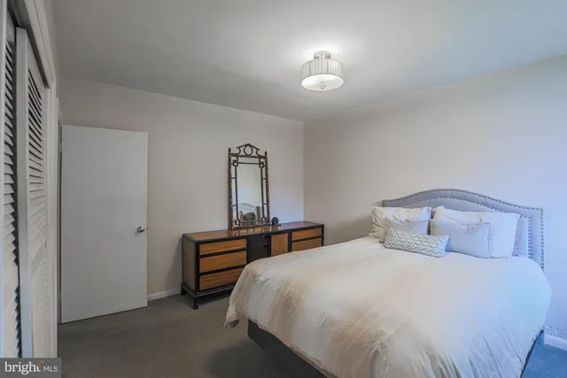 a bedroom with two beds and a window