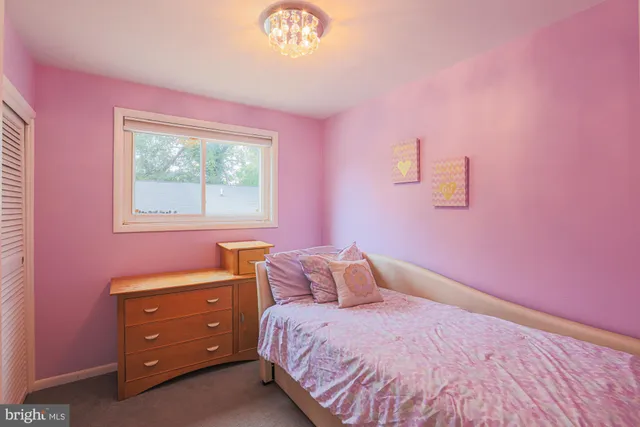 a bathroom with a sink mirror and toilet