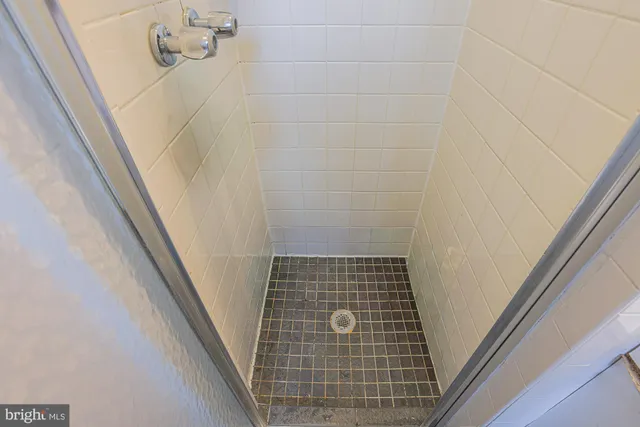 a bedroom with two beds and a window