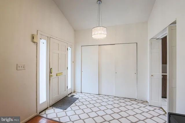 a bedroom with a bed and a table in it