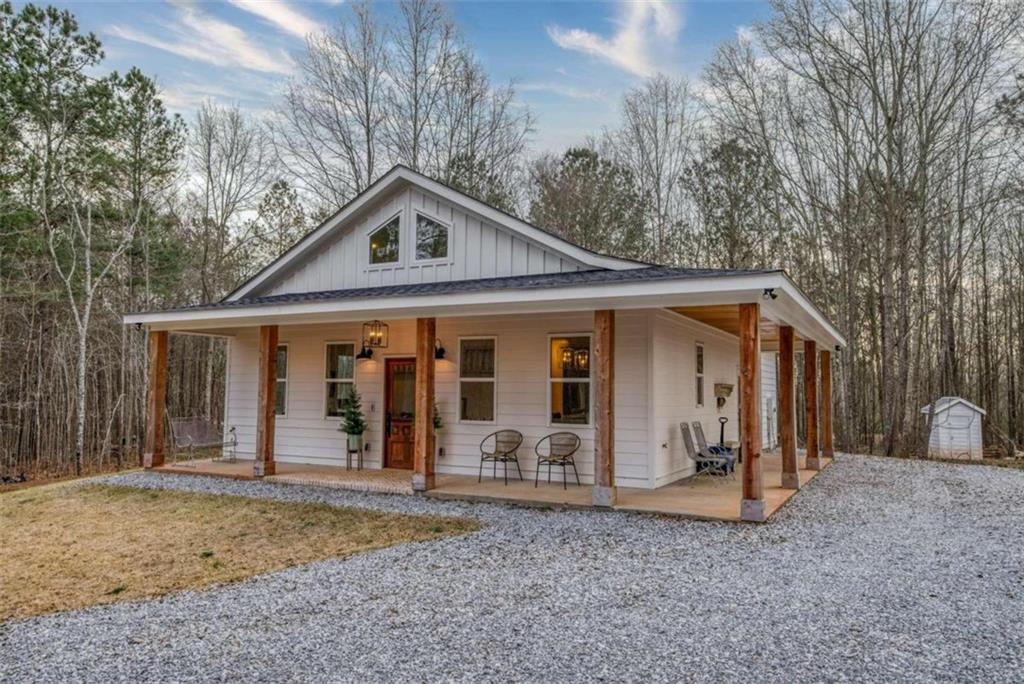 415 Atlanta Highway Rutledge, GA 30663 - Photo 1 of 1 a view of a house with a yard and large tree