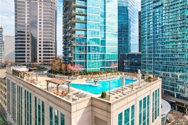 a table and chairs sitting in front of a bathroom