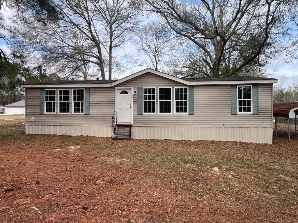 a house with trees in the background