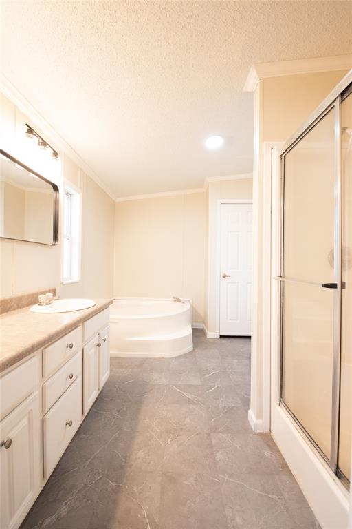 128 Fob Lane Frierson, LA 71027 - Photo 14 of 22 a spacious bathroom with a bathtub and a double vanity sink