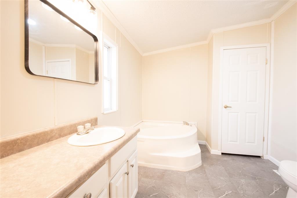 128 Fob Lane Frierson, LA 71027 - Photo 15 of 22 a bathroom with a sink and a mirror