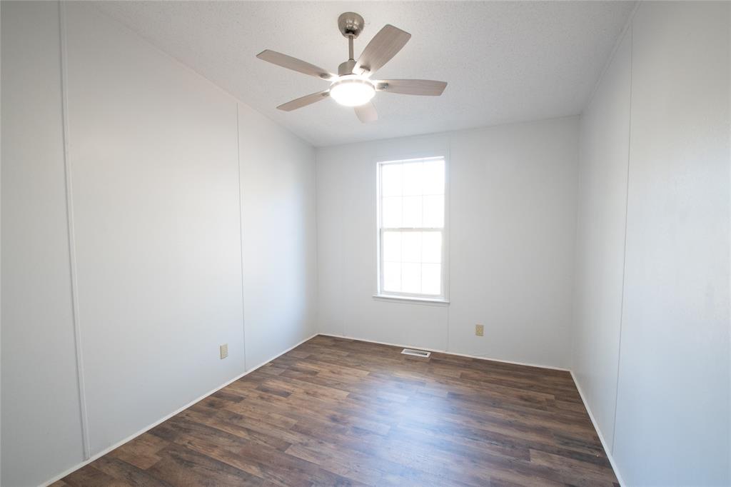 128 Fob Lane Frierson, LA 71027 - Photo 18 of 22 an empty room with a window and a fan